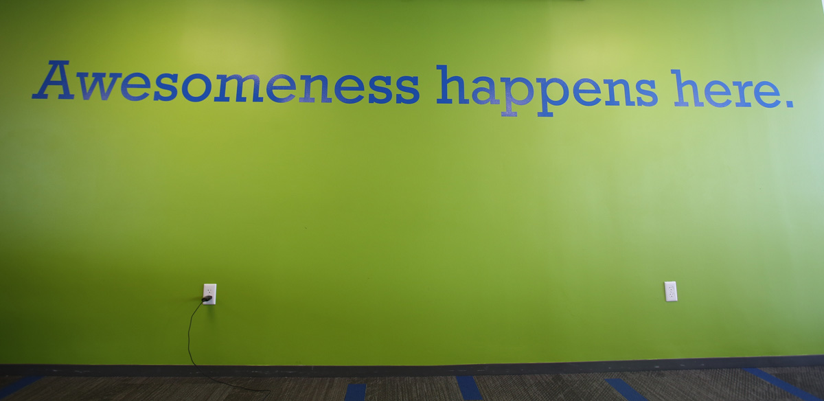 MetaGeek's office wall reads, "Awesomeness happens here"