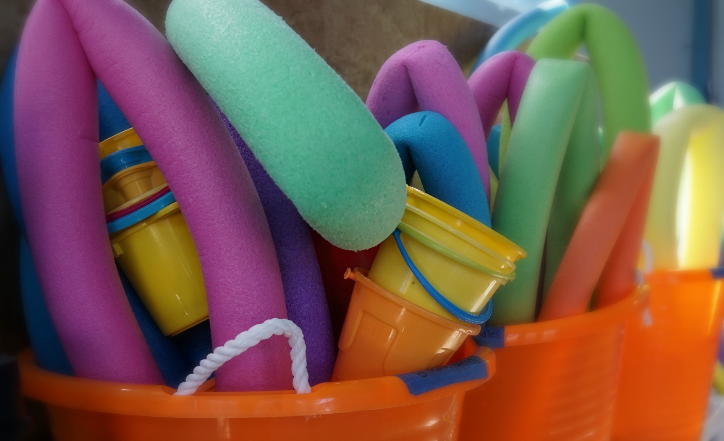 Flow Aquatics pool noodles and buckets