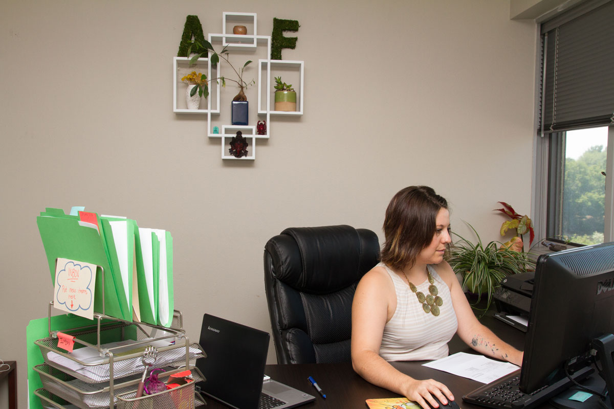 The Auction Frogs "A" and "F" are scattered throughout the office.