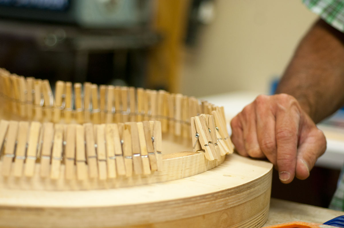 Clothes pins surrounding a work-in-progress Clark Mandolin