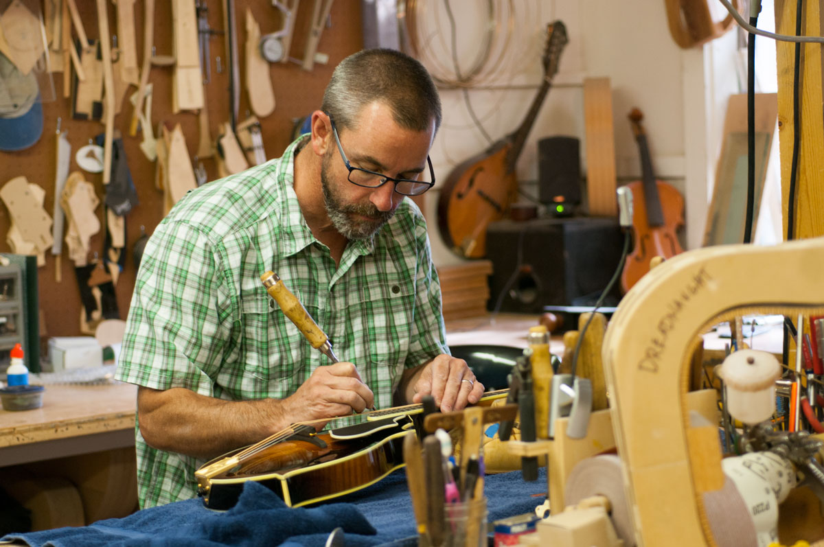 Austin Clark putting the final touches on a mandolin