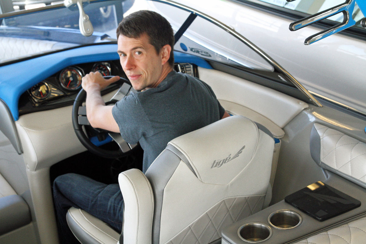Outdoor Toy Share founder Kyle Sales driving boat