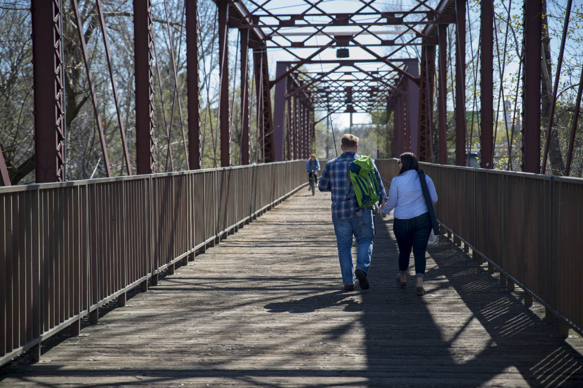 Annalisa and Ken crossing bridge in Boise